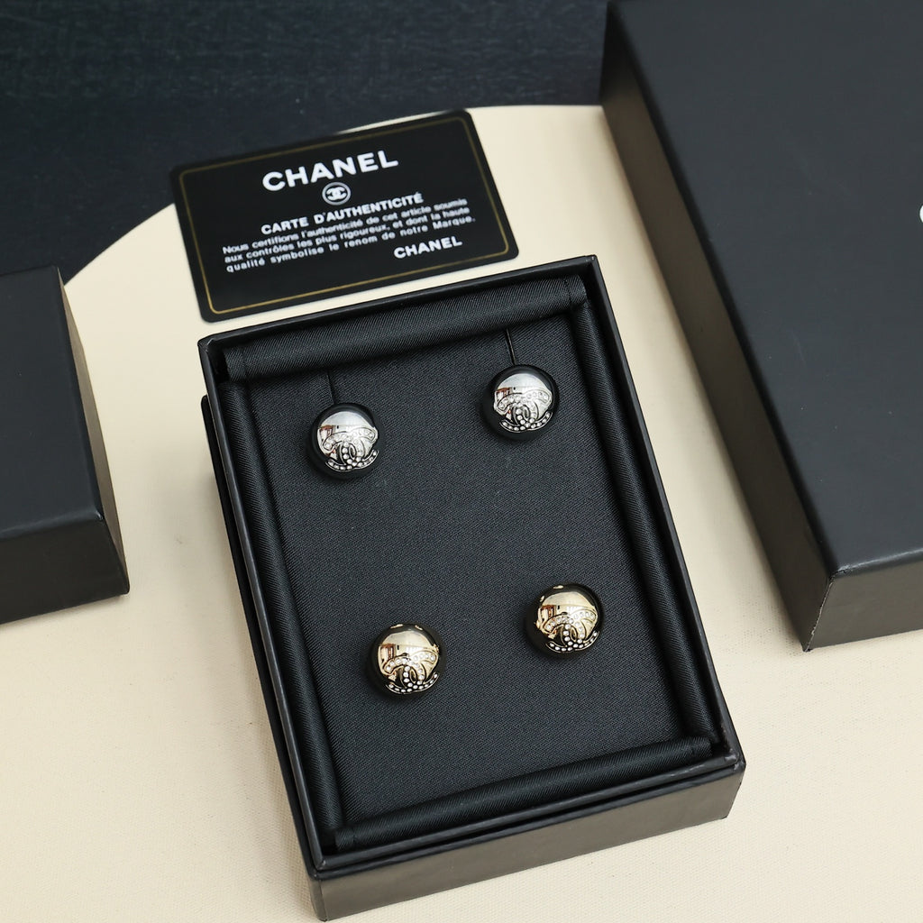 Chanel stud earrings set in black display box, four round logo studs