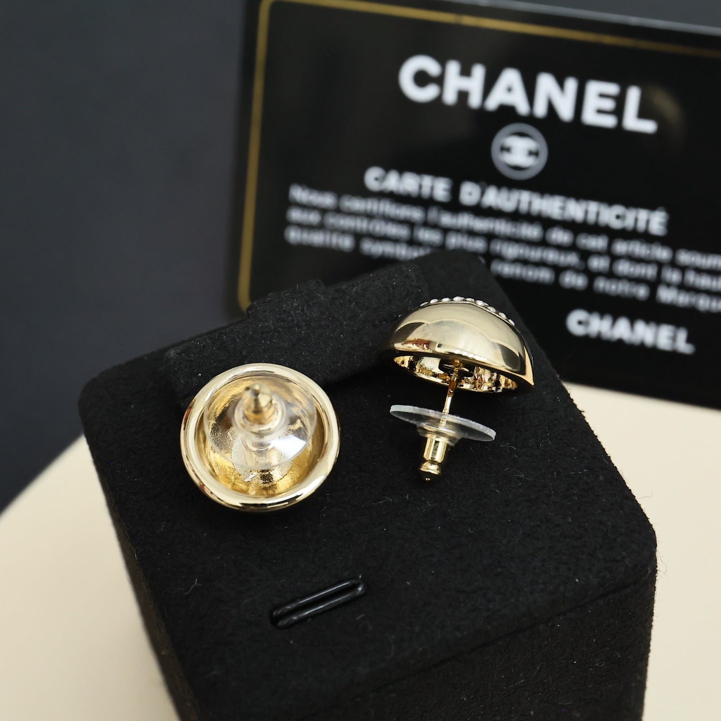 Chanel stud earrings, round metal with engraved logo detail