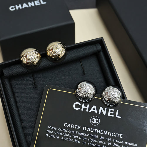 Chanel stud earrings in black box, round silver-tone logo discs