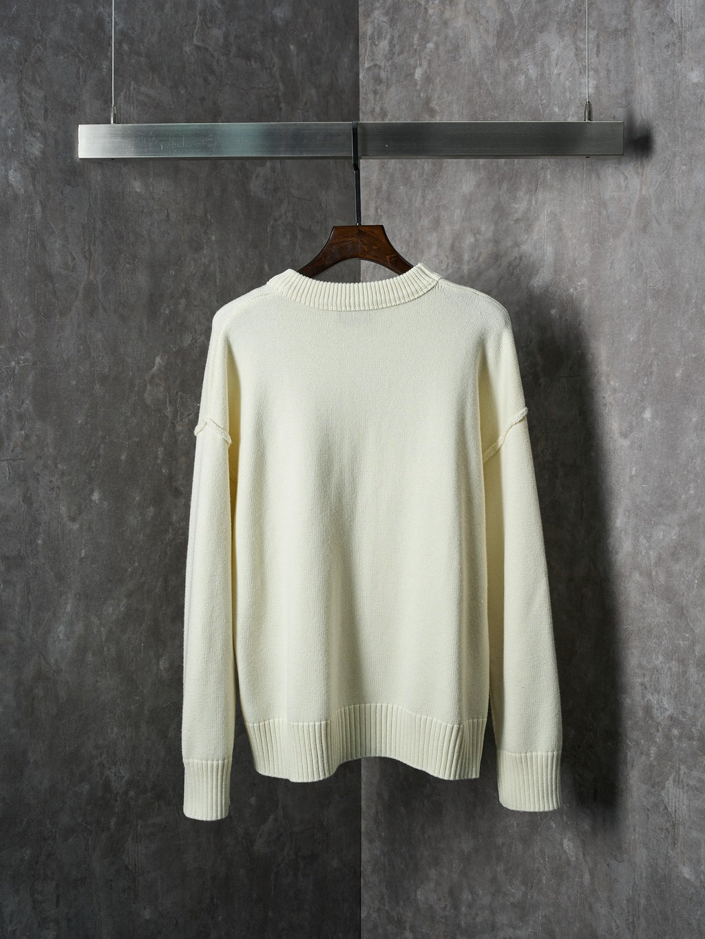 Cream knit sweater with crew neck and ribbed hem, plain back view
