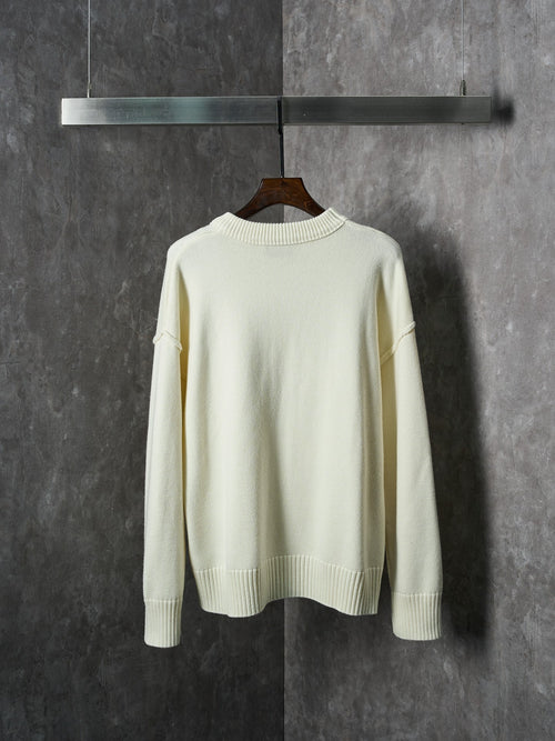 Cream knit sweater with crew neck and ribbed hem, plain back view