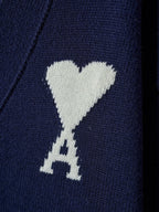 White heart and A emblem knit on navy cardigan fabric