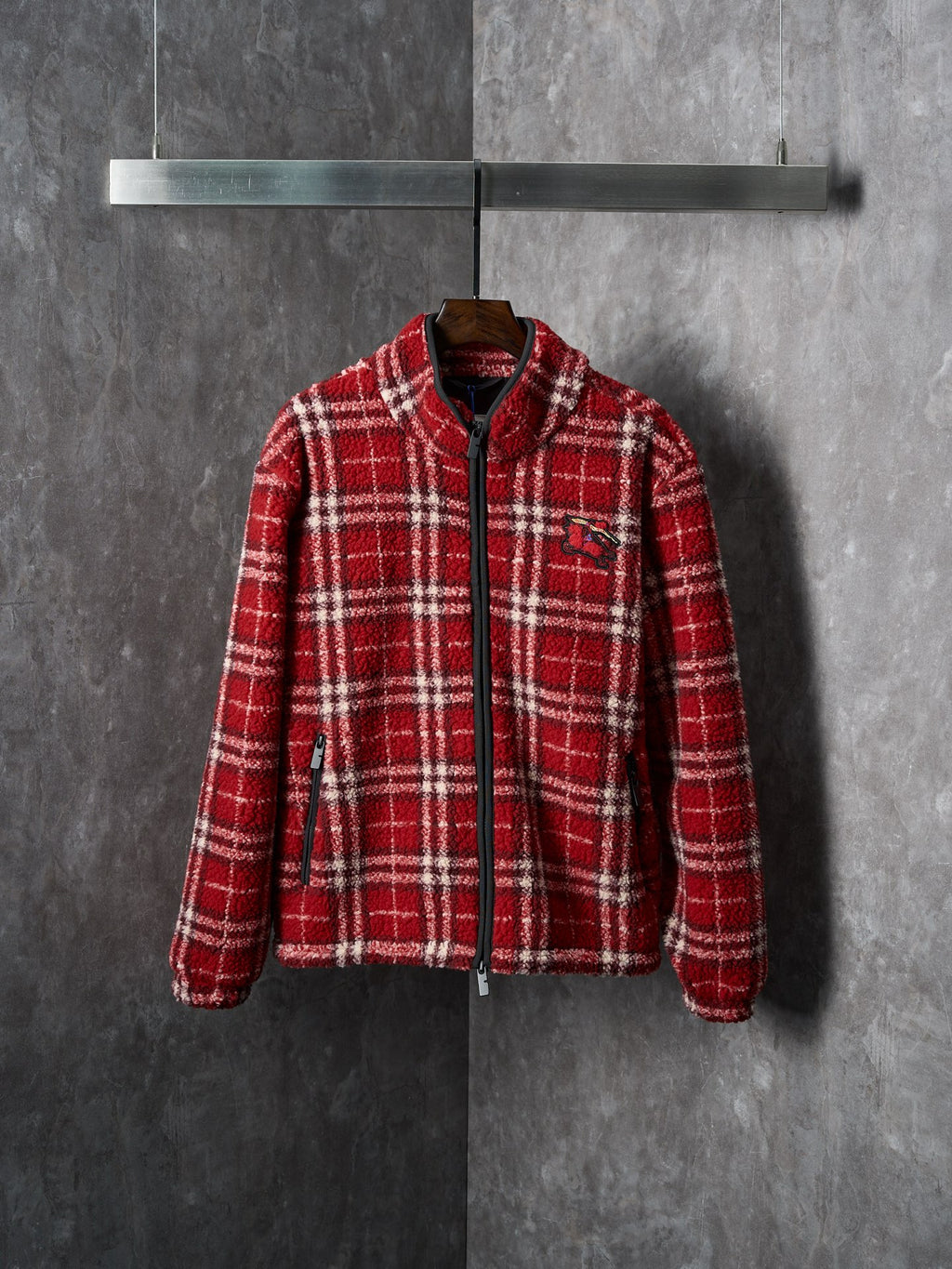 Red plaid zip-up jacket with stand collar and long sleeves