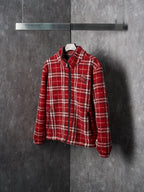 Red plaid zip-up jacket on hanger, side view