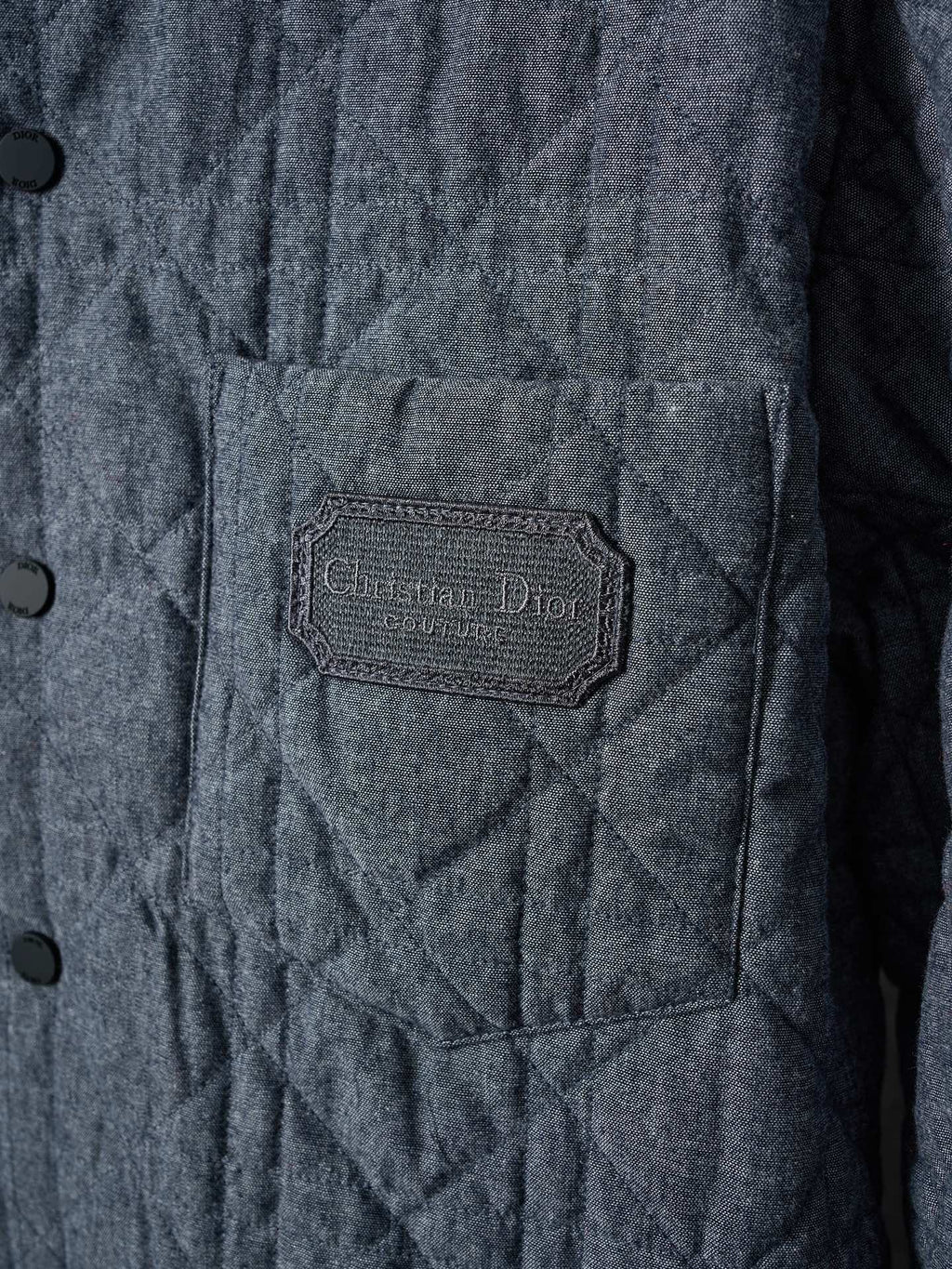 Dior quilted jacket chest pocket with branded woven label patch