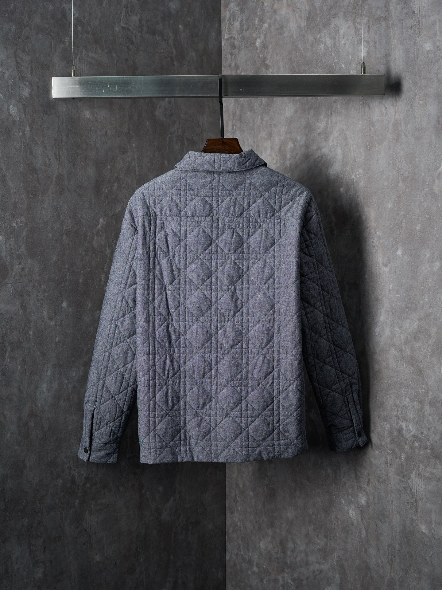 Long quilted Dior jacket, blue-gray with stand collar, back view
