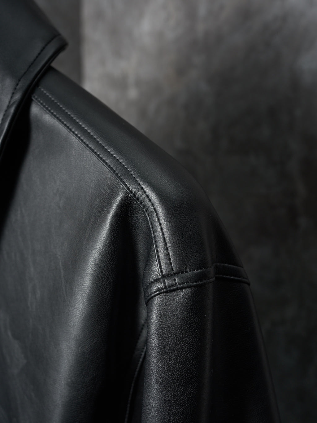 Dior black leather jacket sleeve with stitched seam detail