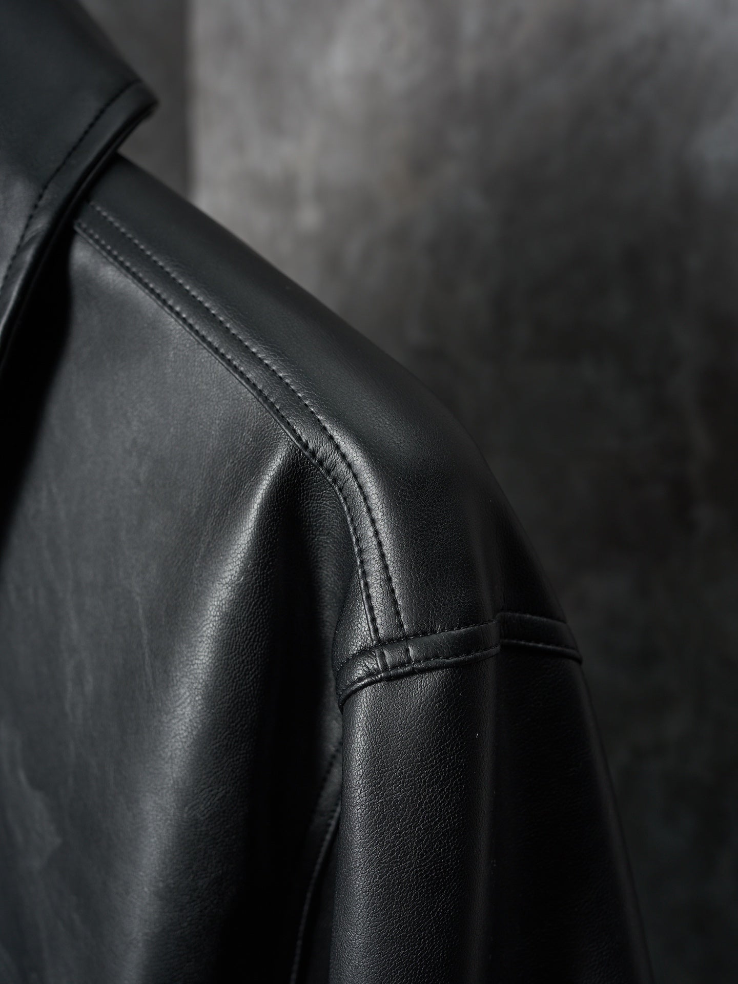 Dior black leather jacket sleeve with stitched seam detail