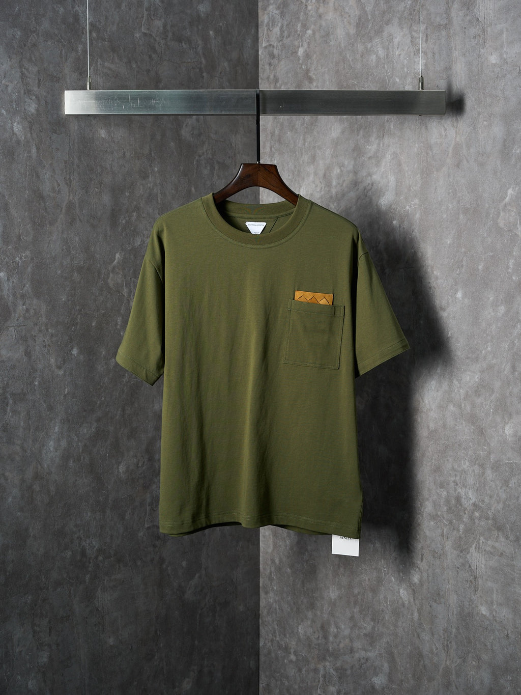 Olive green short-sleeve T-shirt with chest pocket and small logo label