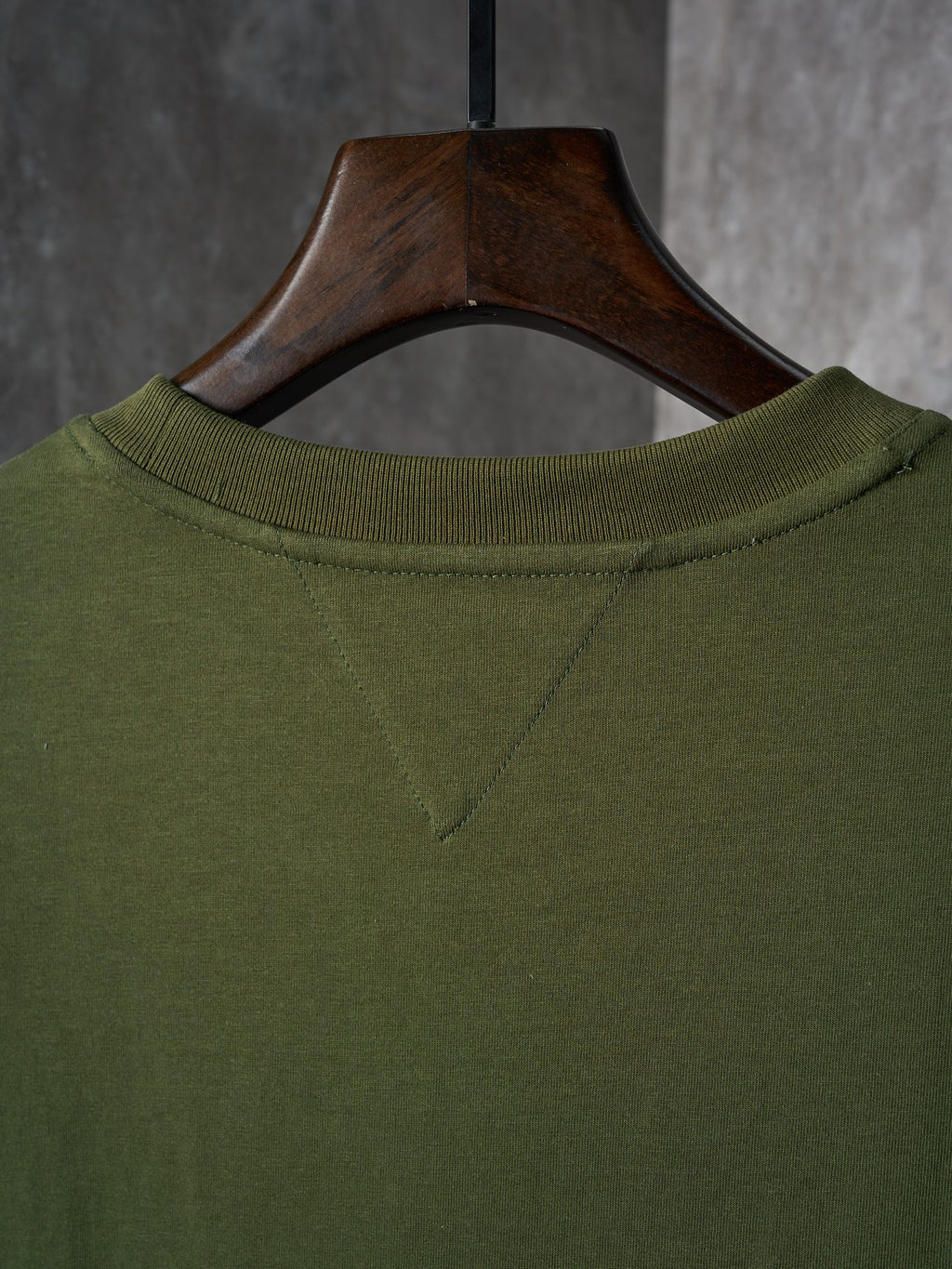Olive green crew-neck T-shirt with stitched neckline detail