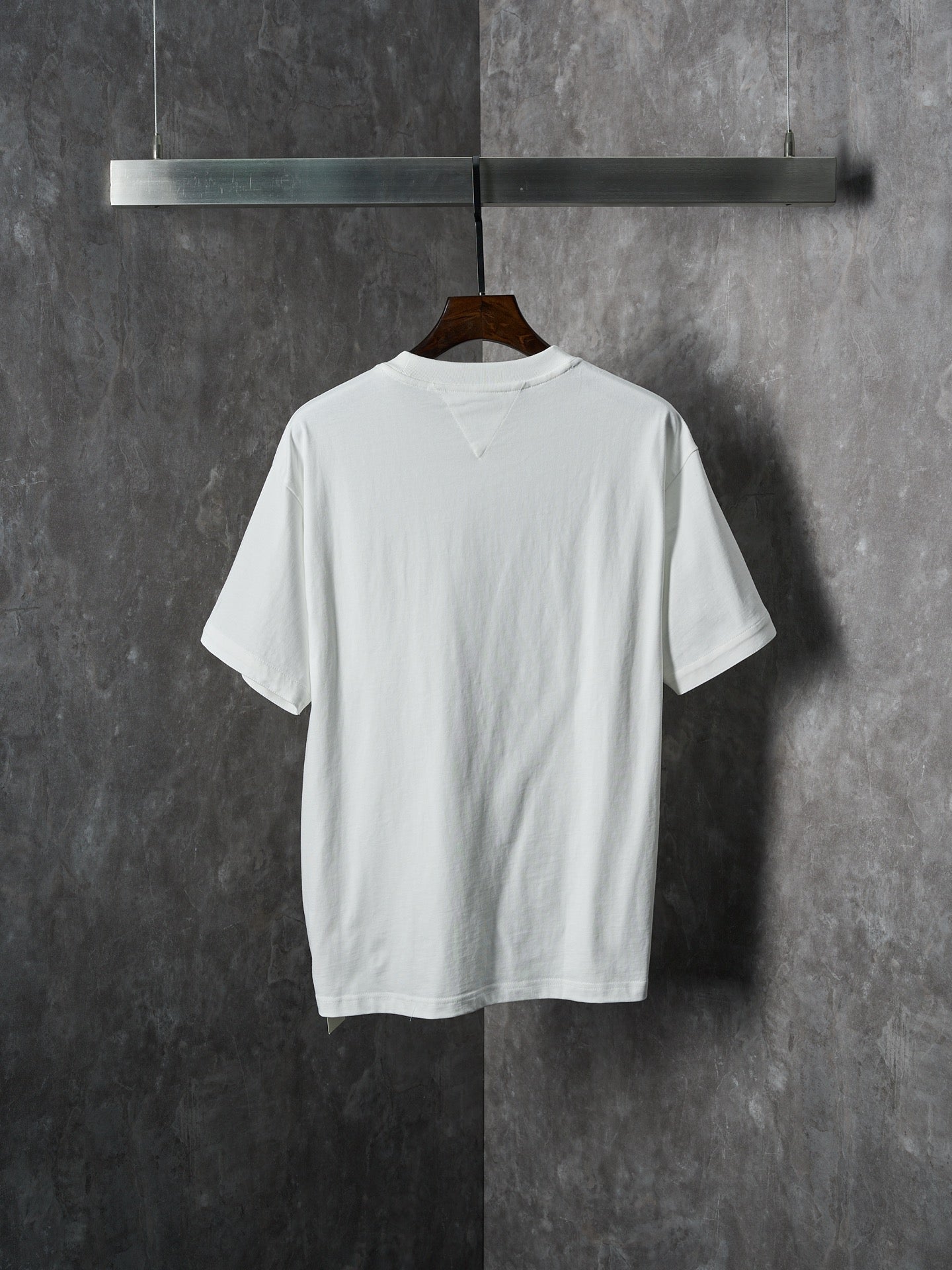 Off-white T-shirt with crew neck, short sleeves, and plain back view