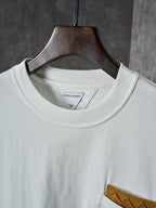 Off-white T-shirt neckline with inner brand label at the crew collar