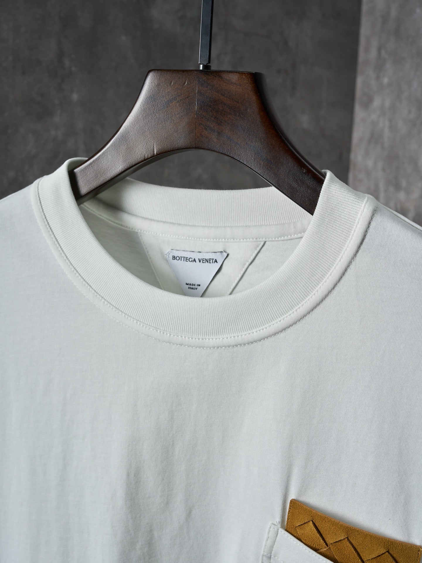 Off-white T-shirt neckline with inner brand label at the crew collar