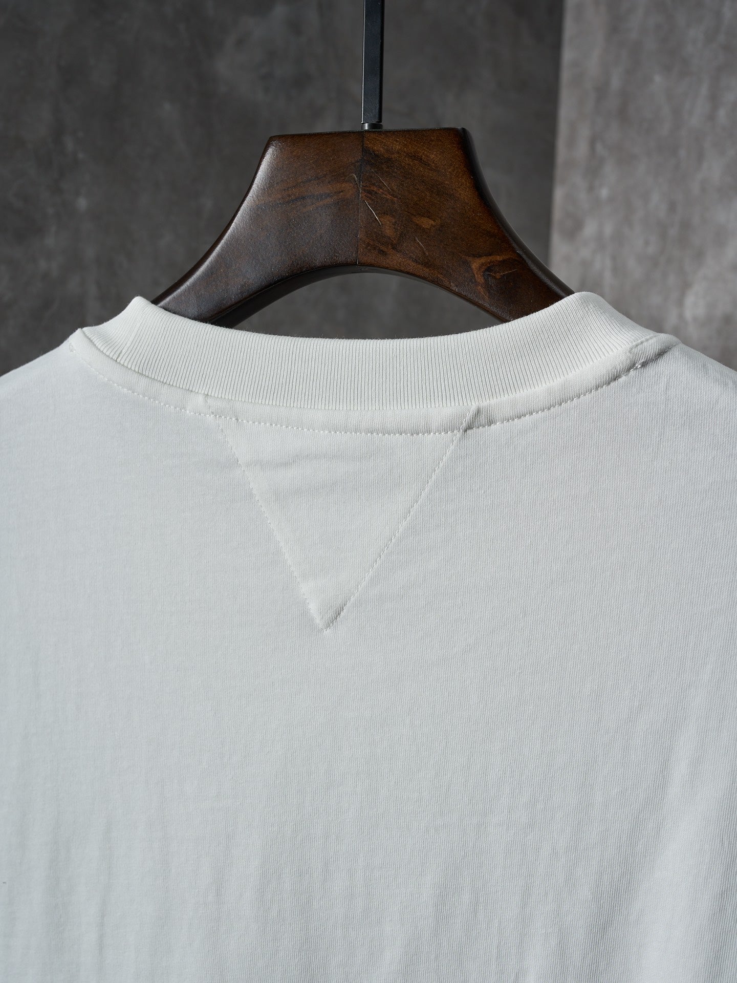 Off-white T-shirt back neck with subtle seam detail under the collar