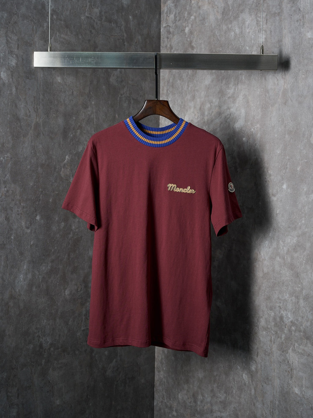 Burgundy short-sleeve T-shirt with ribbed striped crew neck and small chest logo