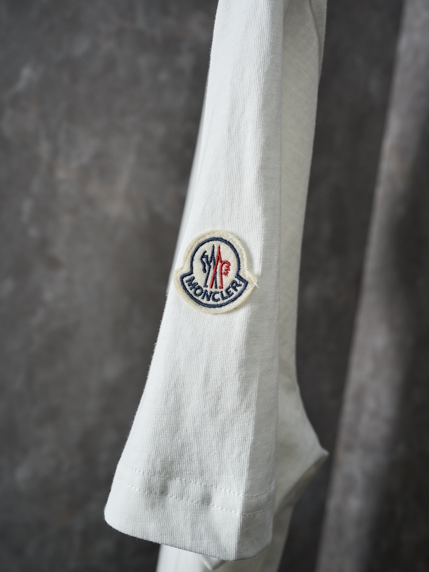White Moncler T-shirt sleeve with circular logo patch