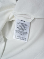White Moncler T-shirt care label tag on interior