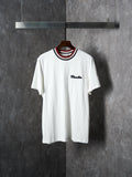 White Moncler T-shirt with ribbed striped collar and small chest logo