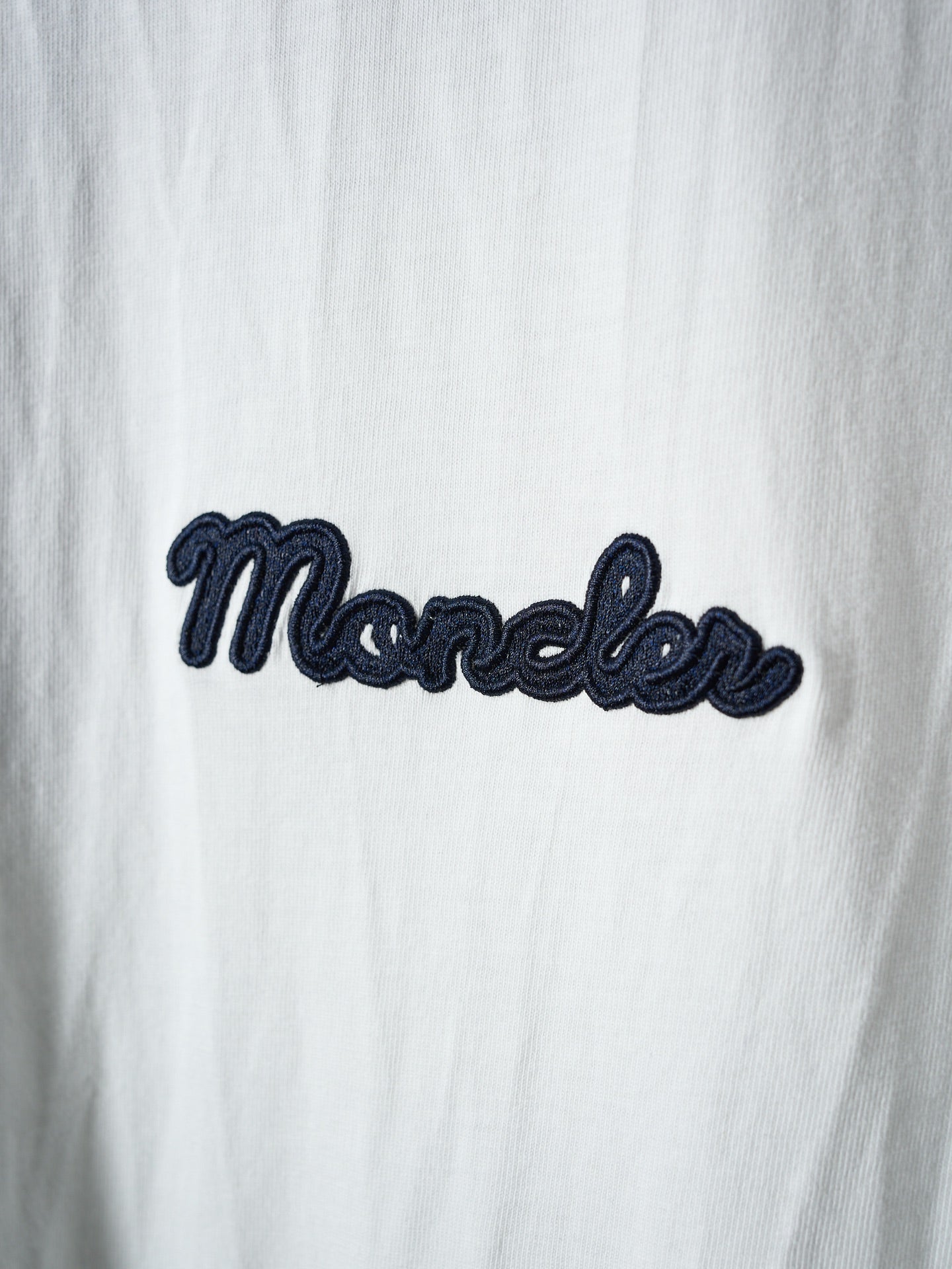 White Moncler T-shirt with navy embroidered script logo