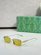 Gucci rectangular sunglasses with yellow lenses, gold-tone frame, and beaded temple detail
