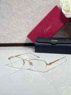 Clear-lens eyeglasses with gold metal frames and rectangular shape