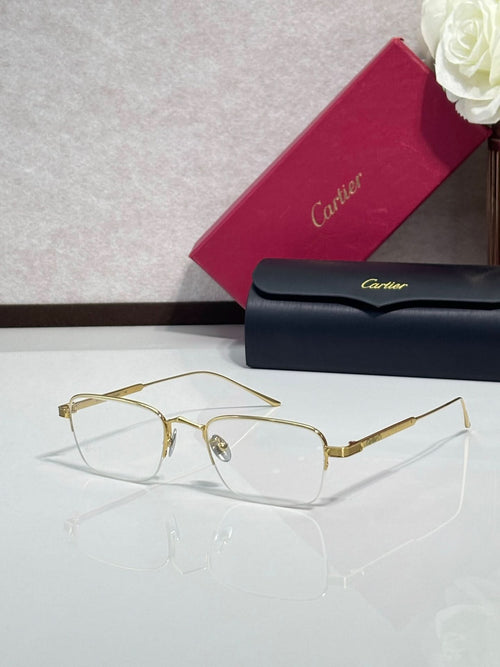 Clear-lens eyeglasses with gold metal frames and rectangular shape
