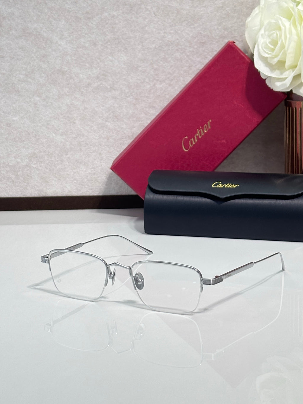 Clear-lens eyeglasses with silver metal frames and rectangular shape