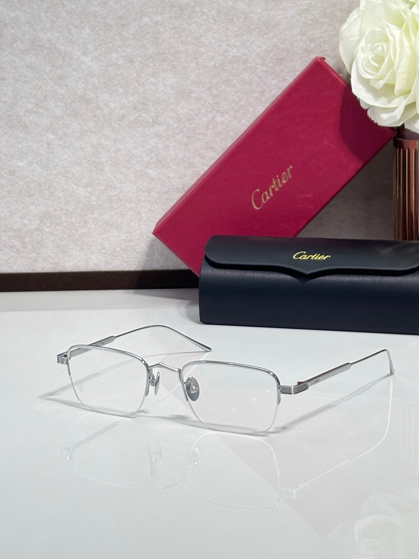 Clear-lens eyeglasses with silver metal frames and rectangular shape