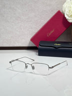Clear-lens eyeglasses with dark metal frames and rectangular shape