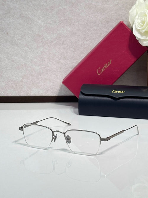 Clear-lens eyeglasses with dark metal frames and rectangular shape