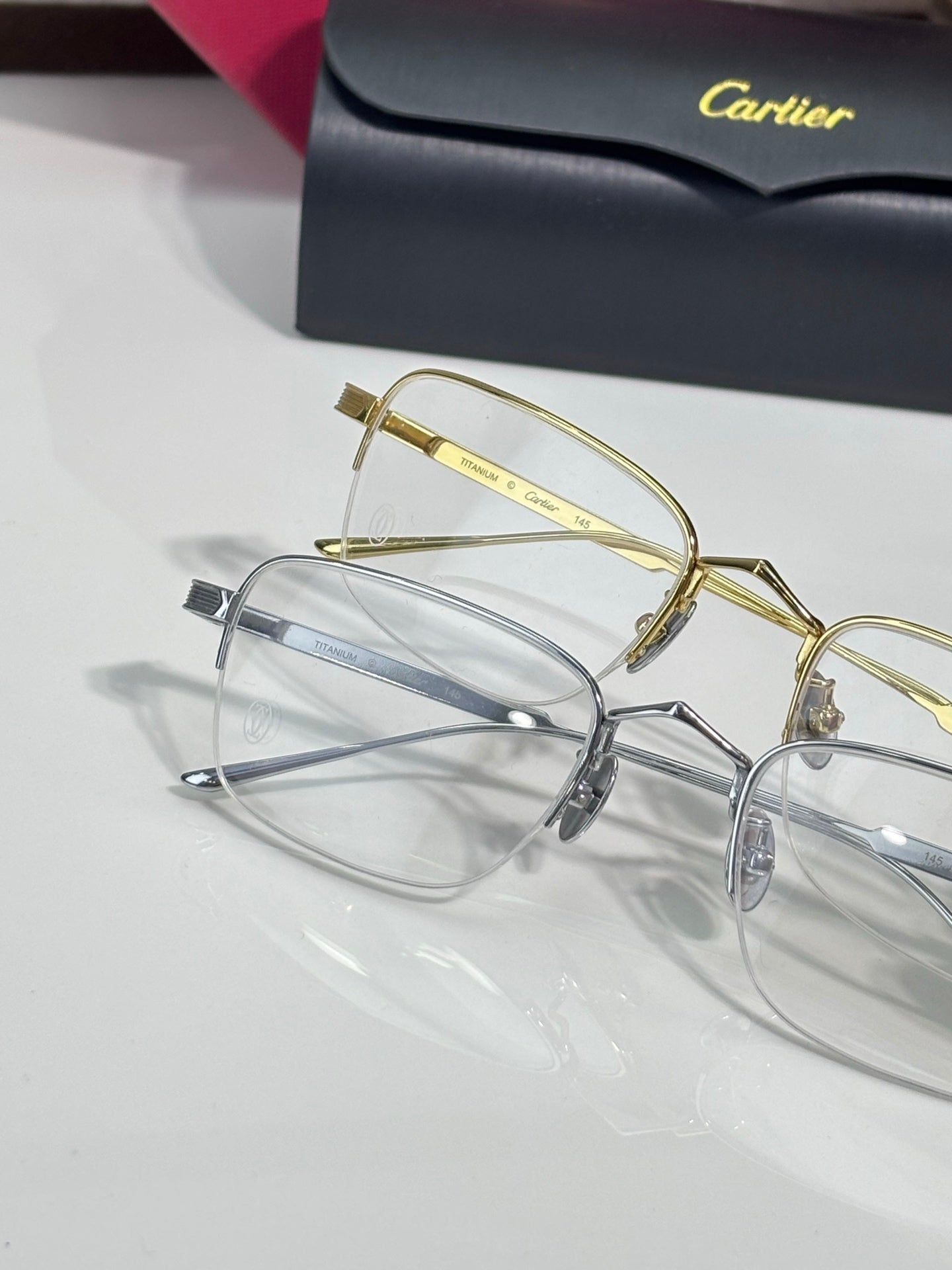 Pair of clear-lens eyeglasses with gold and silver metal frames