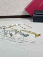 Clear-lens eyeglasses with gold metal rims and gray nose bridge