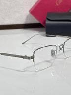 Clear-lens eyeglasses side view with silver metal frame