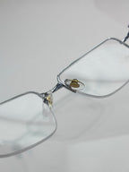 Cartier eyeglasses with clear rectangular lenses and gold-tone bridge with logo detail