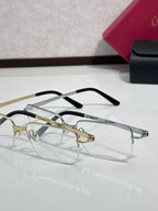 Cartier eyeglasses set with gold and black frames, clear rectangular lenses