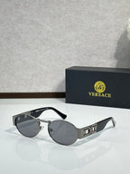 Versace round sunglasses with silver frame and dark gray lenses, black temples