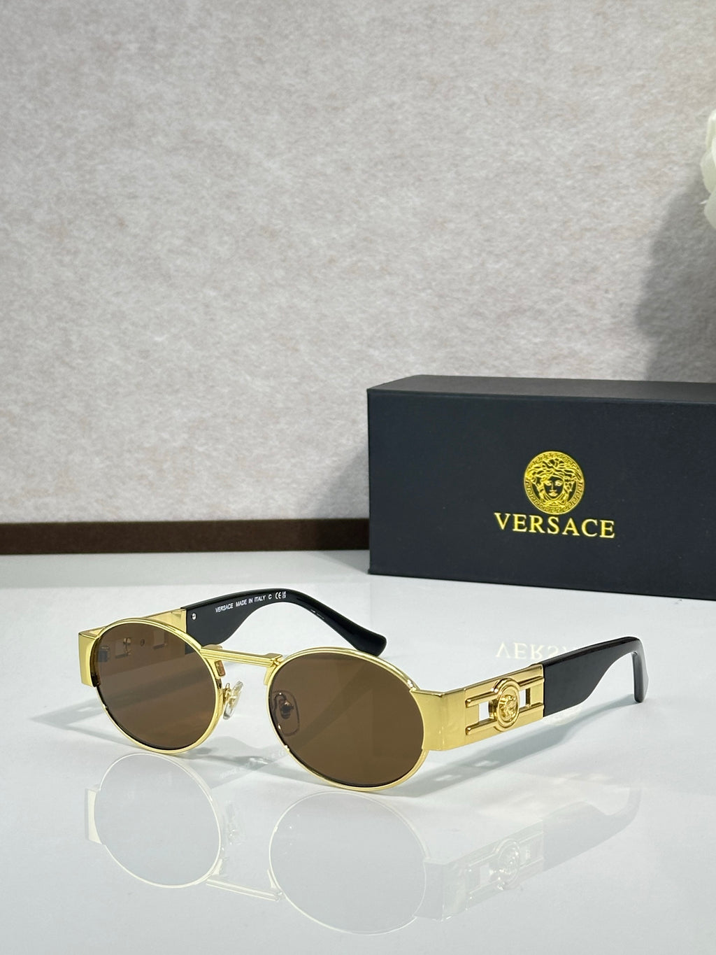 Versace round sunglasses with gold frame and dark brown lenses, double bridge