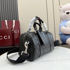 Dark gray GG monogram handbag with two top handles and adjustable shoulder strap