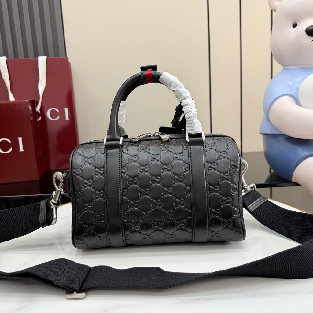 Dark gray GG monogram handbag with top handles and wide shoulder strap