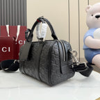 Dark gray GG monogram handbag with zipper front pocket and shoulder strap