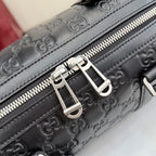 Dark gray GG monogram handbag close-up of front zipper and silver hardware