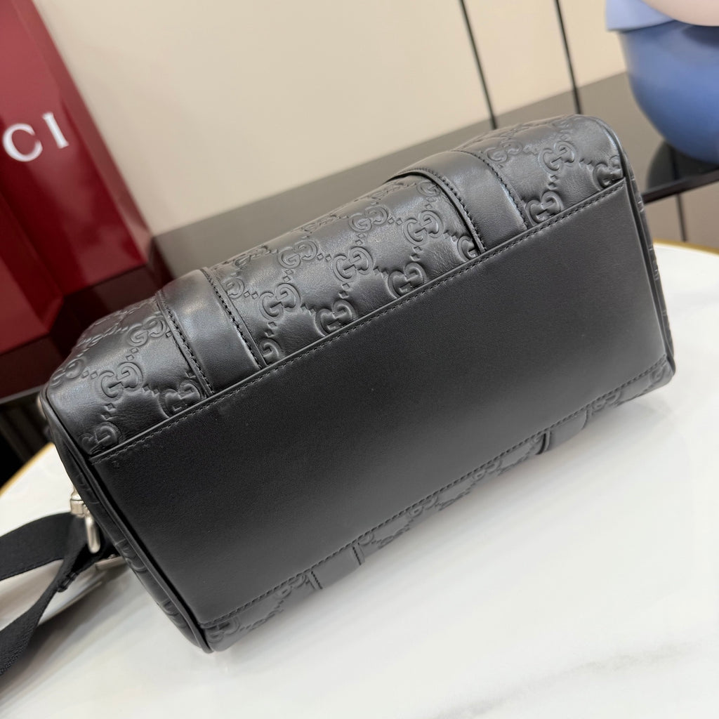 Dark gray GG monogram handbag with leather front panel and top handle base