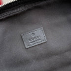 Gucci bag interior label patch on fabric lining, dark gray