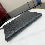 Black Gucci GG-pattern wristlet pouch bag with zipper and long side strap