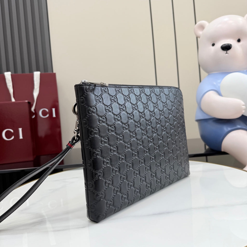Gucci GG monogram crossbody pouch bag, dark color with adjustable strap and zip.