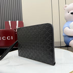 Gucci GG monogram zip pouch bag, dark color with side profile and strap.