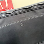 Gucci bag exterior with small leather logo stamp and stitched trim
