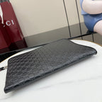 Gucci pouch bag in dark monogram canvas with zip top, side view