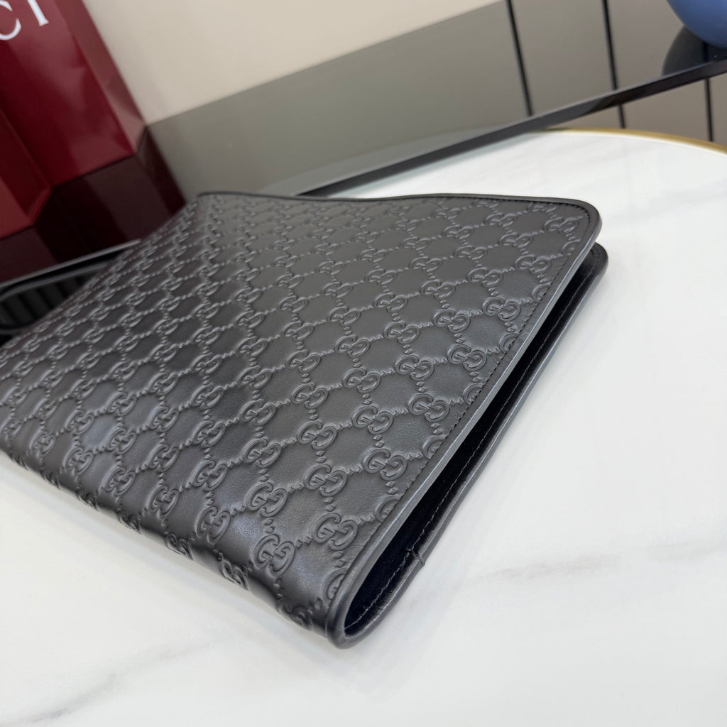Gucci GG-embossed leather bag, dark gray, curved flap front