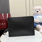 Gucci bag in dark monogram canvas with zip top and wrist strap